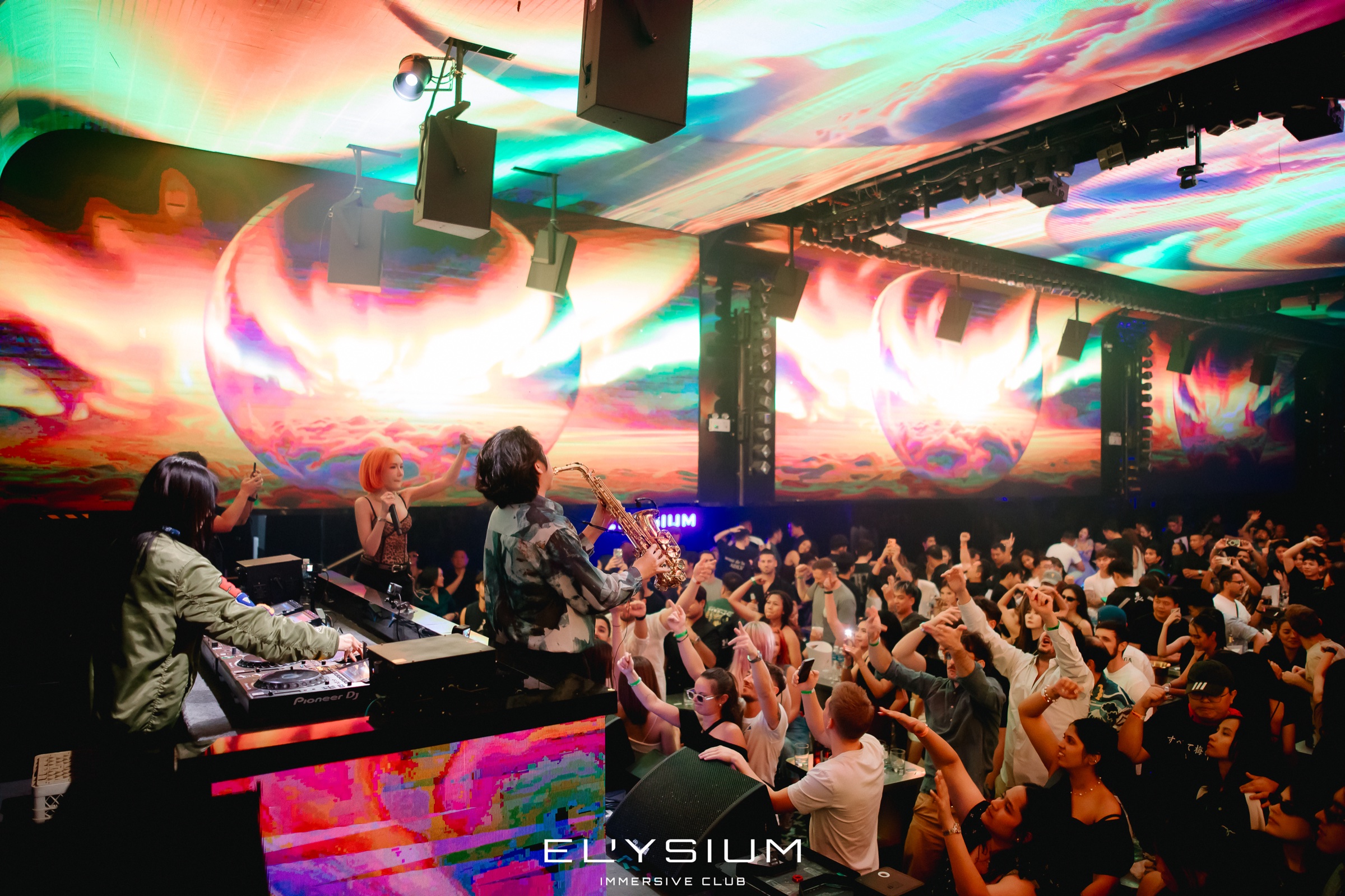 Live DJ performance with crowd at Elysium Bangkok